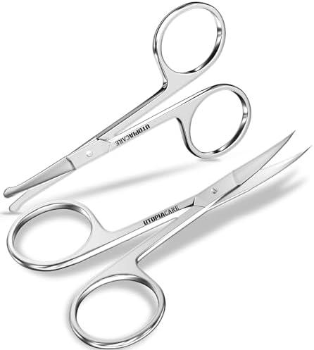 <strong>Top Beauty Tools Reviewed: Tweezers, Scissors & Razors</strong>“></p>
<p>Experience exceptional quality with these professional-grade grooming scissors. Crafted from robust stainless steel, they ensure long-lasting durability without needing frequent replacements. The ergonomic, non-slip handle design provides a firm grip, offering excellent control and balance, thereby making your trimming tasks seamless and precise. This multifunctional beauty tool is ideal for trimming mustaches, beards, nose, ear, eyebrows, and eyelashes, making it an essential addition to your grooming kit. Its travel-friendly nature allows it to be conveniently stowed in your bag, ready for quick touch-ups wherever you go.</p>
<p><strong>Pros:</strong></p>
<ul>
<li>Durable stainless steel construction</li>
<li>Non-slip, ergonomic handle</li>
<li>Sharp cutting edges for precise trimming</li>
<li>Compact and travel-friendly</li>
<li>Versatile for multiple grooming needs</li>
</ul>
<p><strong>Cons:</strong></p>
<ul>
<li>Requires careful wiping after use to maintain longevity</li>
<li>Some users may find them too small for larger hands</li>
</ul>
<table class=